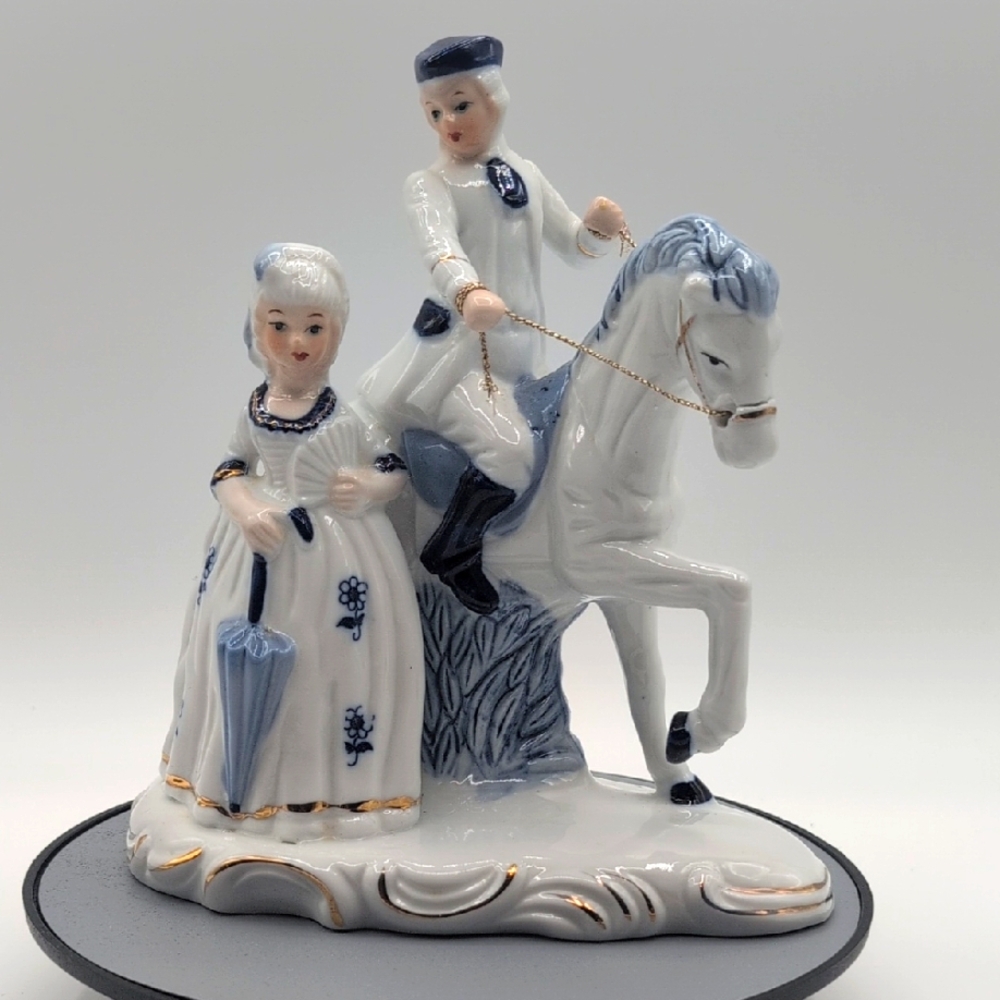 Vintage Deville Colonial Style Elegant Porcelain Figurine with Blue Accents